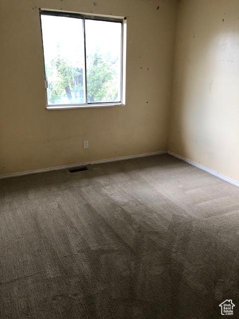 3923 W Rockwood Way Unit G, West Valley City, UT 84120 - spare room with carpet flooring and baseboards