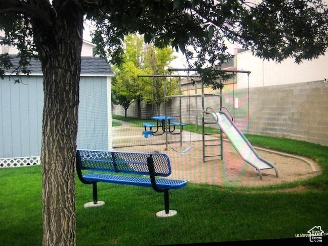 3923 W Rockwood Way Unit G, West Valley City, UT 84120 - community jungle gym with a storage shed