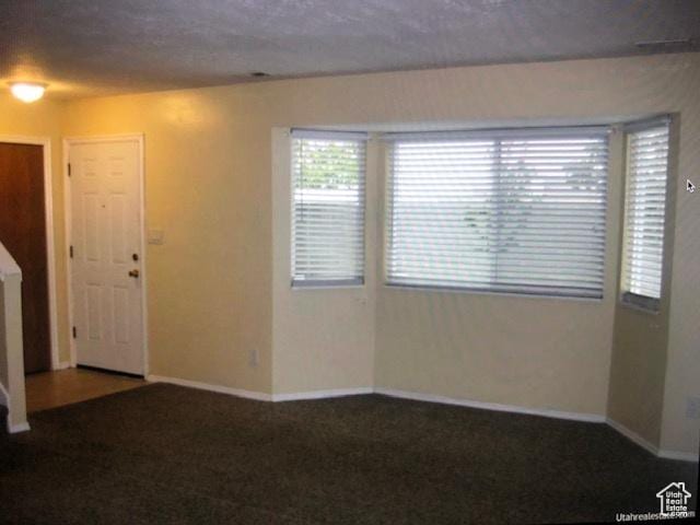 3923 W Rockwood Way Unit G, West Valley City, UT 84120 - spare room featuring baseboards and carpet
