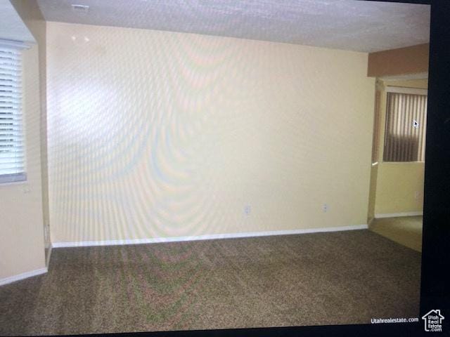 3923 W Rockwood Way Unit G, West Valley City, UT 84120 - spare room featuring carpet flooring and baseboards