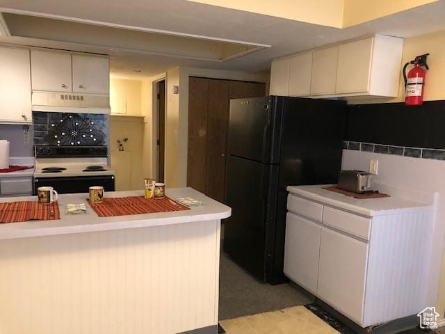 3923 W Rockwood Way Unit G, West Valley City, UT 84120 - kitchen with range with electric cooktop, under cabinet range hood, light countertops, and freestanding refrigerator