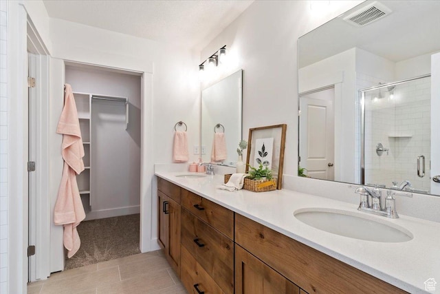 2085 W 1575th Ct S Unit 126, West Haven, UT 84401 - full bath featuring a stall shower, double vanity, and tile patterned floors