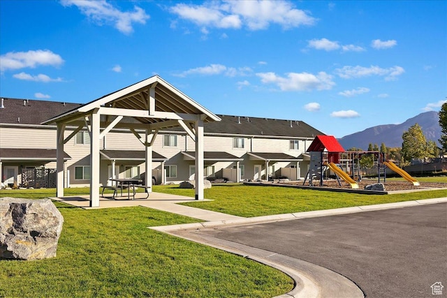 2085 W 1575th Ct S Unit 126, West Haven, UT 84401 - rear view of property featuring a playground, a mountain view, and a yard