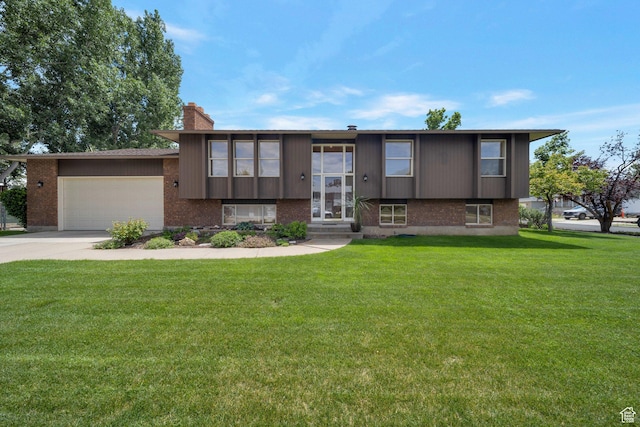 3189 W 925 N, West Point, UT 84015 - bi-level home featuring an attached garage, brick siding, a front yard, and a chimney