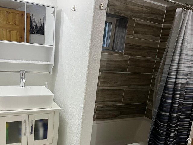 full bathroom featuring shower / tub combo with curtain and vanity