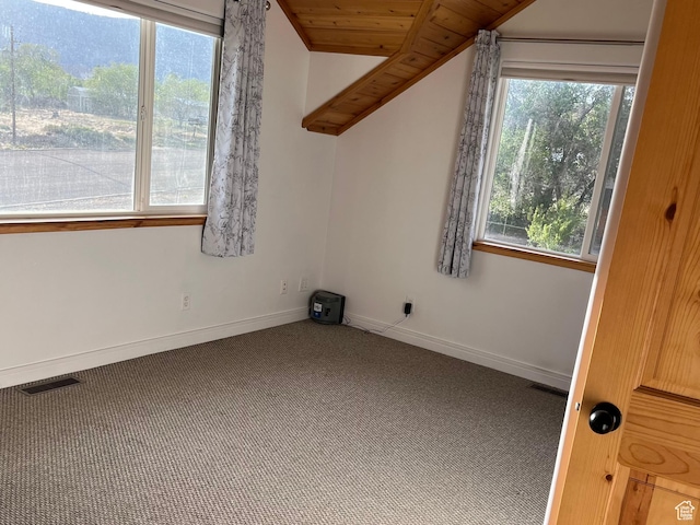 carpeted spare room with baseboards