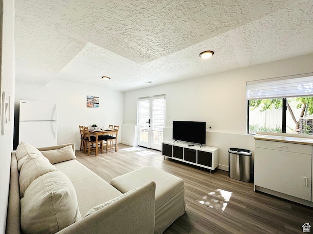 227 S W Ln, Provo, UT 84601 - living area featuring wood finished floors, a textured ceiling, and baseboards
