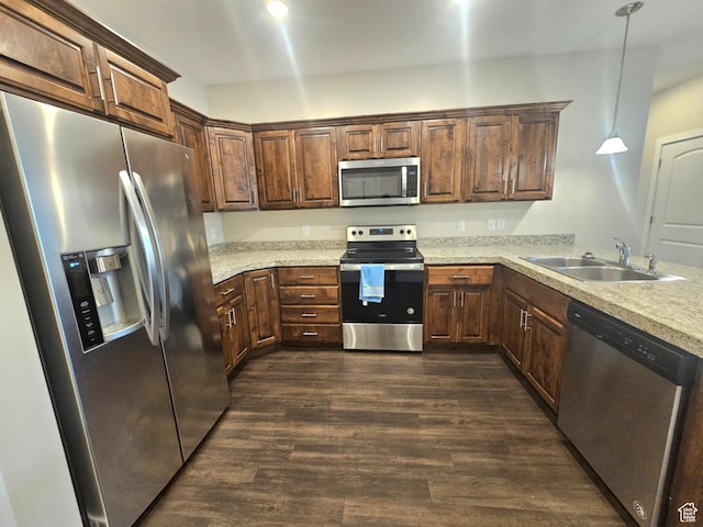 1704 W 300 S Unit Ud/L24, Mapleton, UT 84664 - kitchen with appliances with stainless steel finishes, a sink, dark wood-type flooring, decorative light fixtures, and a peninsula