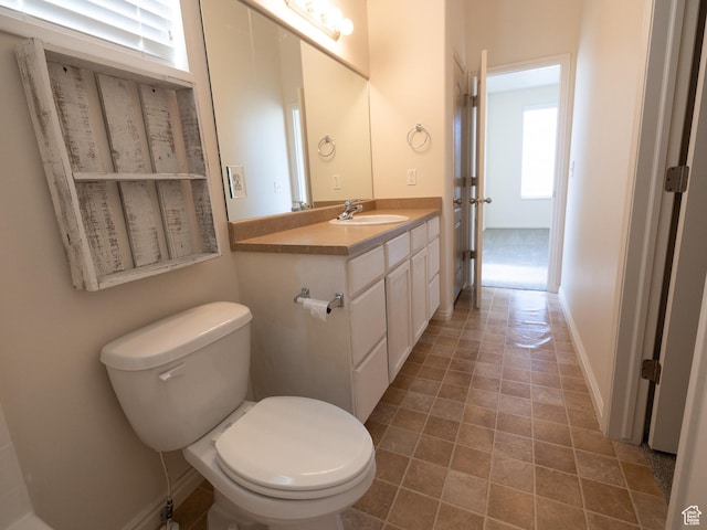 6324 S Traveler Ln W, West Jordan, UT 84081 - bathroom with toilet, vanity, french doors, and baseboards