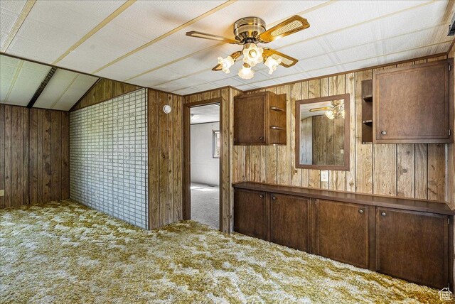 830 E Main St, Grantsville, UT 84029 - kitchen featuring ceiling fan, carpet, wooden walls, and lofted ceiling