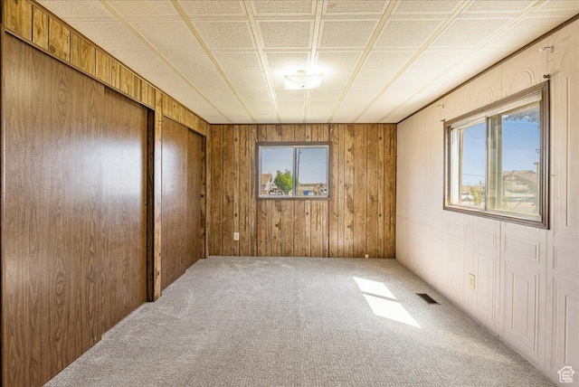 830 E Main St, Grantsville, UT 84029 - empty room with carpet floors and wood walls