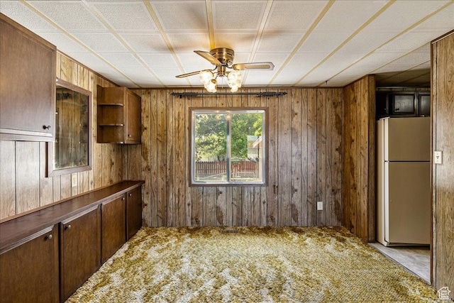 830 E Main St, Grantsville, UT 84029 - kitchen featuring freestanding refrigerator, wood walls, carpet flooring, ceiling fan, and open shelves