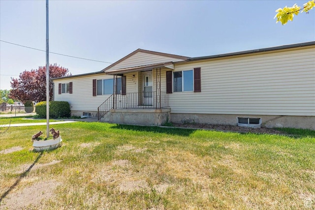 830 E Main St, Grantsville, UT 84029 - view of front of home featuring a front lawn and covered porch