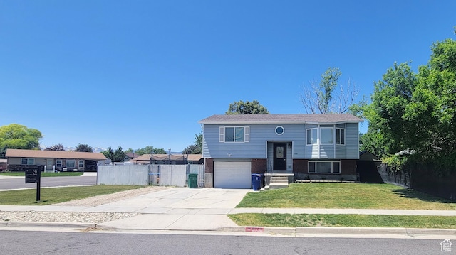 6330 S 4015 W, Taylorsville, UT 84129 - raised ranch featuring driveway, an attached garage, and brick siding