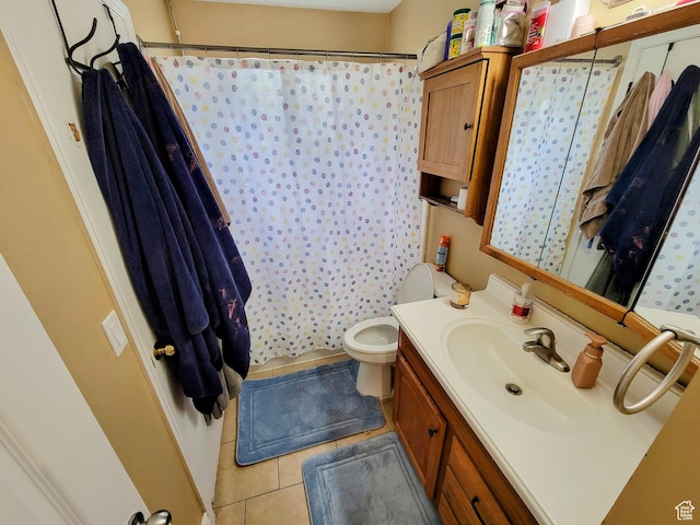 bathroom featuring tile patterned flooring, vanity, toilet, and a shower with curtain