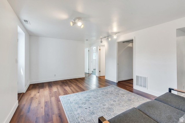 living area with dark wood-style floors and baseboards