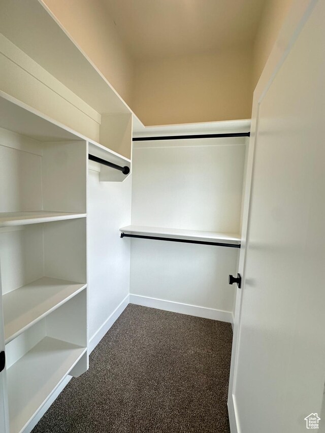 7838 S Holden St, Midvale, UT 84047 - walk in closet featuring dark colored carpet
