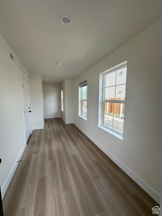 7838 S Holden St, Midvale, UT 84047 - unfurnished room with baseboards and dark wood-type flooring