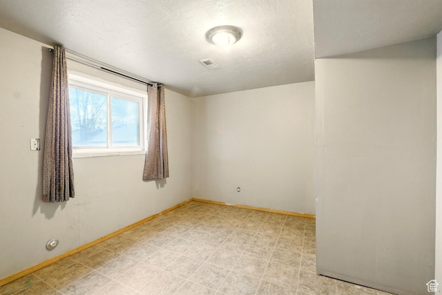 1170 N 1600 W, Lewiston, UT 84320 - empty room featuring baseboards, a textured ceiling, and light floors