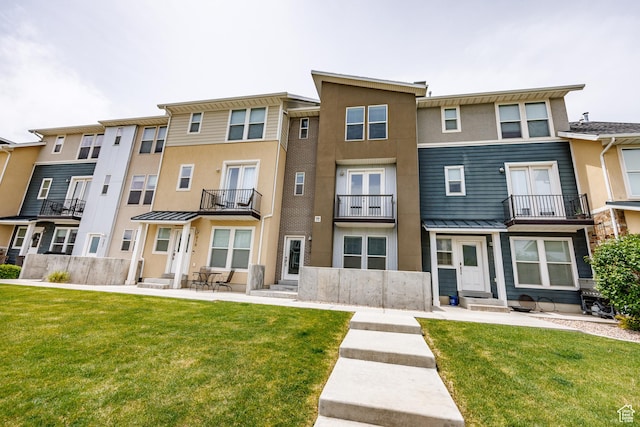 972 S High Ridge Rd, Spanish Fork, UT 84660 - rear view of house featuring entry steps, stucco siding, and a yard