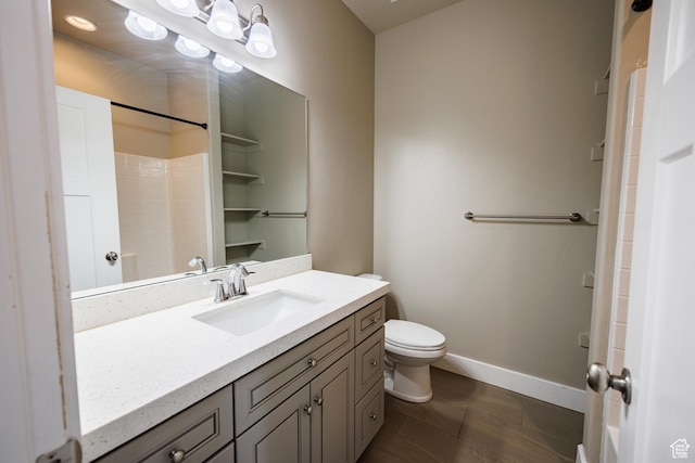 972 S High Ridge Rd, Spanish Fork, UT 84660 - full bath with vanity, toilet, baseboards, tile patterned flooring, and a shower