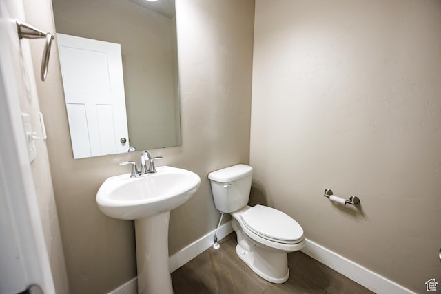 972 S High Ridge Rd, Spanish Fork, UT 84660 - half bathroom featuring toilet, baseboards, and a sink