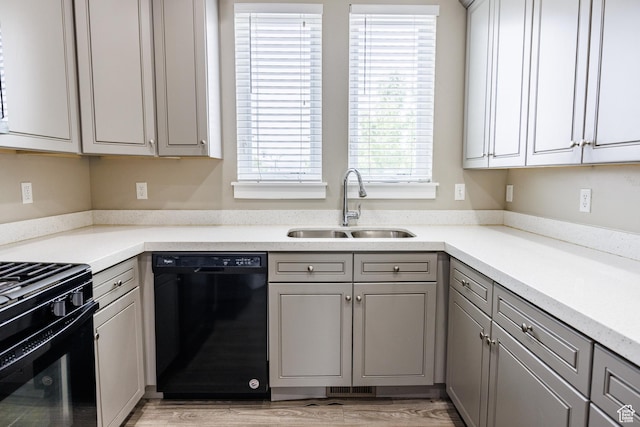 972 S High Ridge Rd, Spanish Fork, UT 84660 - kitchen with black appliances, a sink, gray cabinets, light countertops, and light wood finished floors