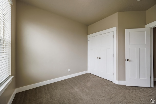 972 S High Ridge Rd, Spanish Fork, UT 84660 - unfurnished bedroom with carpet flooring, baseboards, and a closet