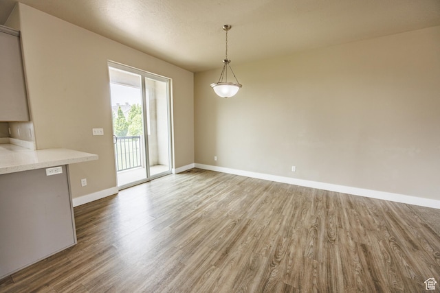 972 S High Ridge Rd, Spanish Fork, UT 84660 - unfurnished dining area featuring wood finished floors and baseboards