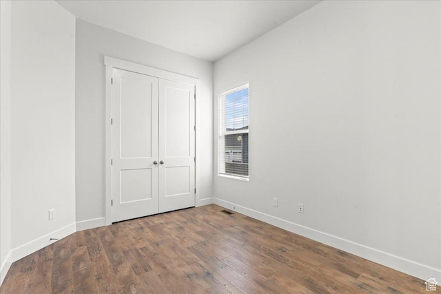5153 W Lake Terrace Ave S, South Jordan, UT 84009 - unfurnished bedroom with baseboards, wood finished floors, and a closet