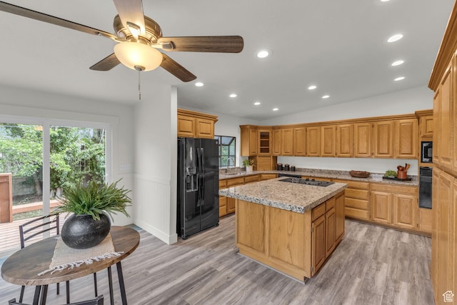 770 W 550 N, Clearfield, UT 84015 - kitchen with black appliances, a sink, a kitchen island, light wood-type flooring, and recessed lighting