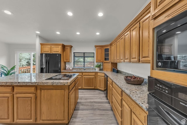 770 W 550 N, Clearfield, UT 84015 - kitchen with black appliances, plenty of natural light, recessed lighting, and light stone counters