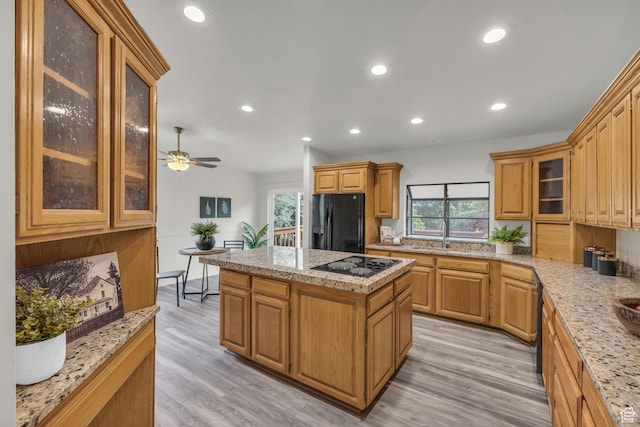 770 W 550 N, Clearfield, UT 84015 - kitchen with black appliances, a kitchen island, healthy amount of natural light, light wood-style flooring, and recessed lighting