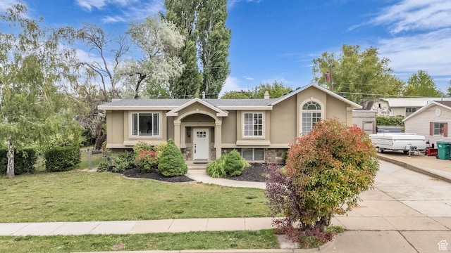 770 W 550 N, Clearfield, UT 84015 - raised ranch with stucco siding, stone siding, a front yard, and driveway