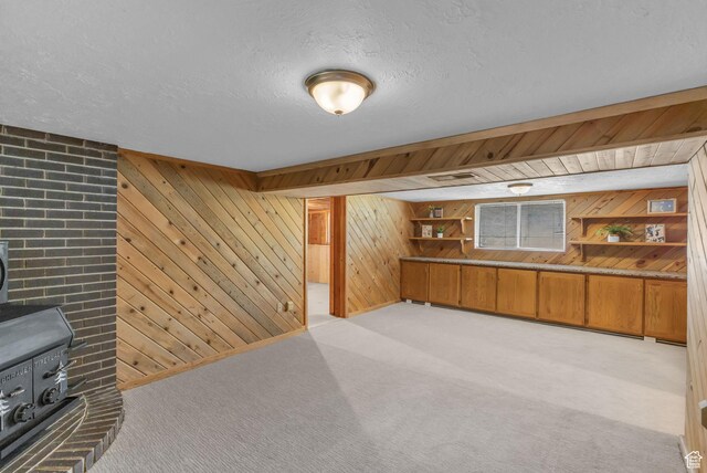 770 W 550 N, Clearfield, UT 84015 - bar area with wood walls, a wood stove, light carpet, and a textured ceiling