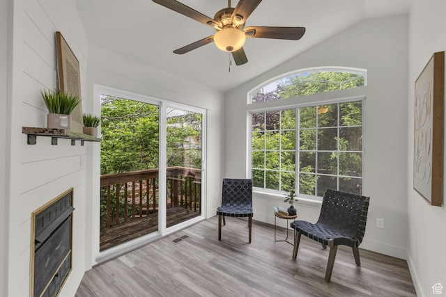770 W 550 N, Clearfield, UT 84015 - sitting room with lofted ceiling, a glass covered fireplace, wood finished floors, baseboards, and ceiling fan