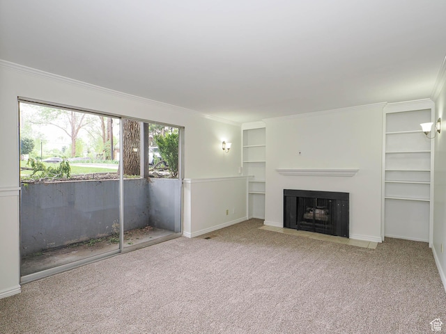 2760 S 2000 E Unit 6A, Salt Lake City, UT 84109 - unfurnished living room with crown molding, built in shelves, carpet, baseboards, and a fireplace with flush hearth