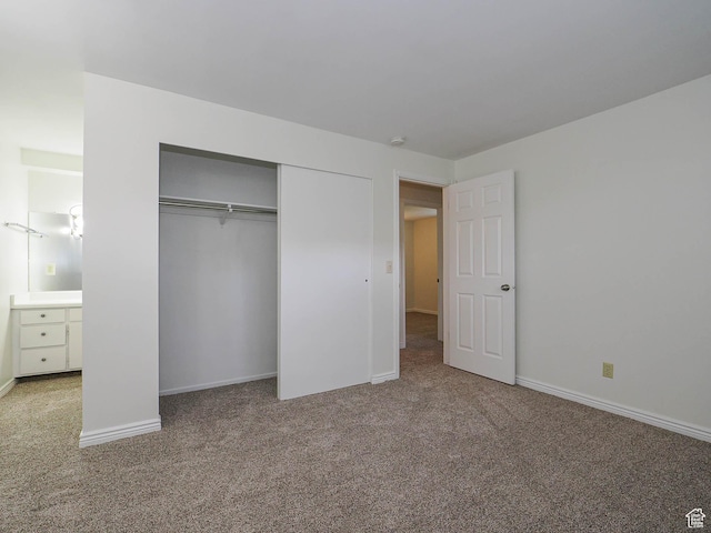 2760 S 2000 E Unit 6A, Salt Lake City, UT 84109 - unfurnished bedroom with carpet floors, a closet, and baseboards