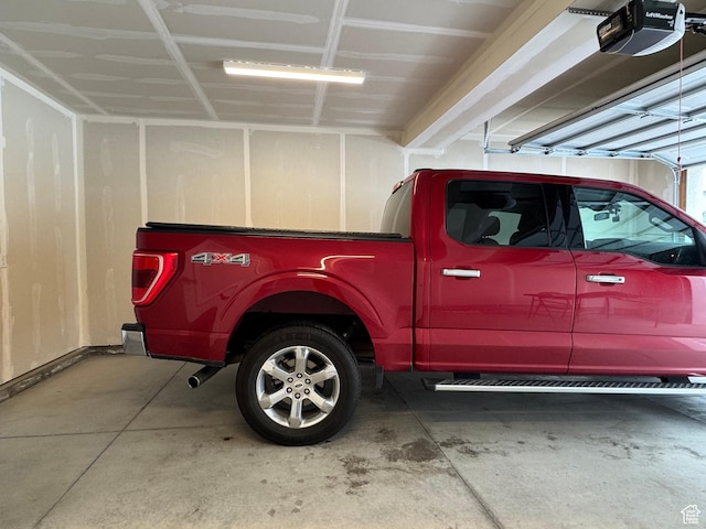 2336 W James Way Unit J34, West Haven, UT 84401 - garage featuring a garage door opener