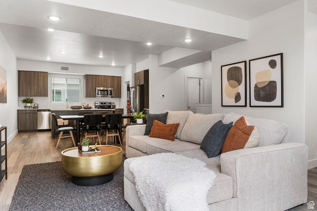 2336 W James Way Unit J34, West Haven, UT 84401 - living room featuring light wood-style floors, recessed lighting, and baseboards
