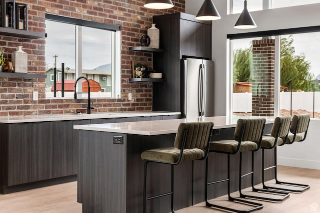 2336 W James Way Unit J34, West Haven, UT 84401 - kitchen with open shelves, freestanding refrigerator, modern cabinets, light countertops, and light wood-style floors