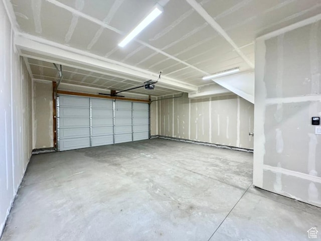 2336 W James Way Unit J34, West Haven, UT 84401 - garage featuring a garage door opener