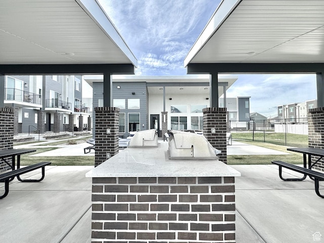 2336 W James Way Unit J34, West Haven, UT 84401 - view of patio / terrace featuring an outdoor kitchen, fence, and a residential view