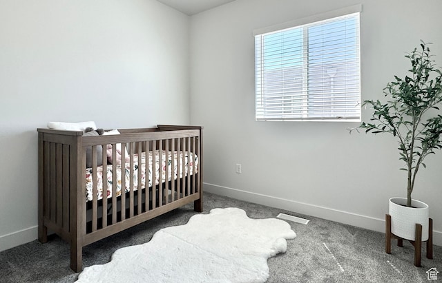 2336 W James Way Unit J34, West Haven, UT 84401 - carpeted bedroom with baseboards and a nursery area