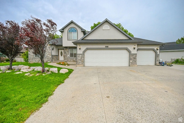 245 E 1400 S, Kaysville, UT 84037 - traditional home with stone siding, stucco siding, driveway, and a garage