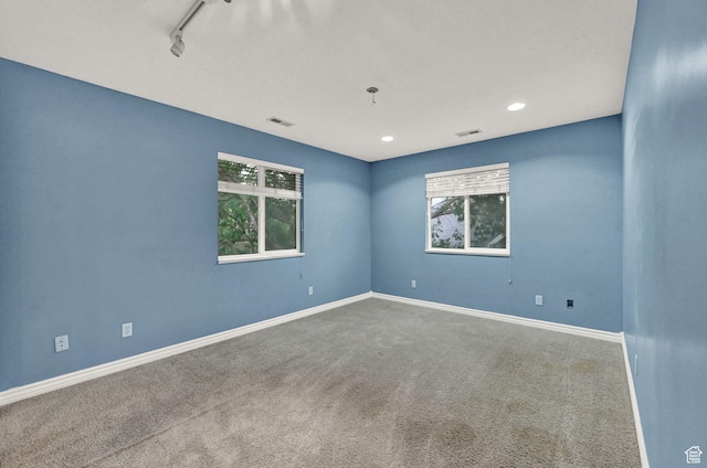 245 E 1400 S, Kaysville, UT 84037 - spare room featuring carpet, healthy amount of natural light, baseboards, rail lighting, and recessed lighting