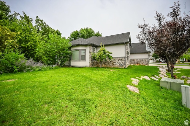 245 E 1400 S, Kaysville, UT 84037 - view of front of home with stone siding, stucco siding, and a front yard