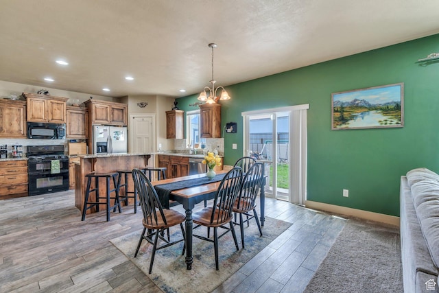 641 W 1450 S, Springville, UT 84663 - dining space featuring light wood finished floors, recessed lighting, a chandelier, and baseboards