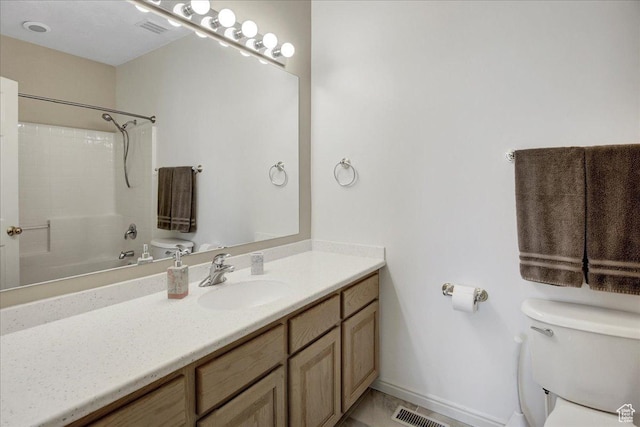 bathroom with toilet and vanity
