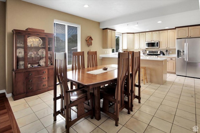 dining space with recessed lighting and light tile patterned flooring